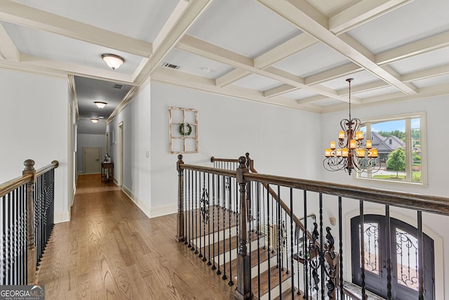 770 Tralee Dr, Fayetteville, GA 30215 - hallway featuring an upstairs landing, an inviting chandelier, visible vents, and coffered ceiling