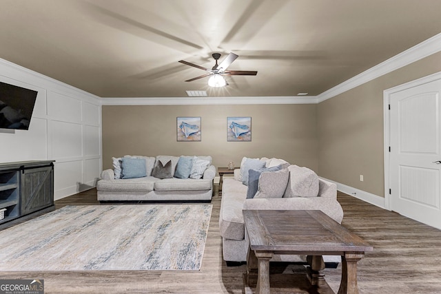 770 Tralee Dr, Fayetteville, GA 30215 - living room featuring baseboards, ceiling fan, crown molding, and wood finished floors