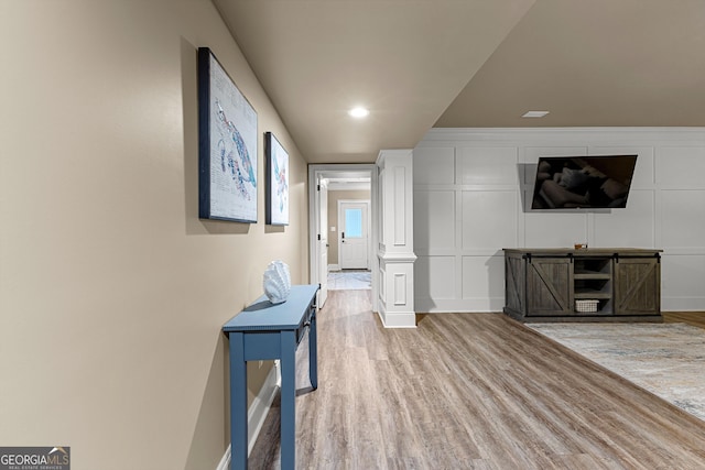 770 Tralee Dr, Fayetteville, GA 30215 - living area featuring a decorative wall, baseboards, and wood finished floors