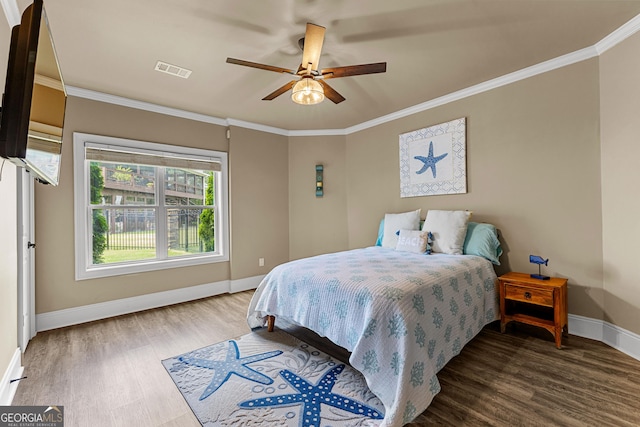 770 Tralee Dr, Fayetteville, GA 30215 - bedroom with wood finished floors, crown molding, visible vents, baseboards, and ceiling fan
