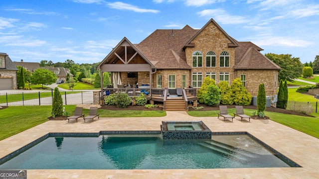 770 Tralee Dr, Fayetteville, GA 30215 - back of house with fence, brick siding, a yard, a patio, and a wooden deck