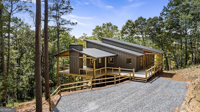 view of front of property with a wooden deck