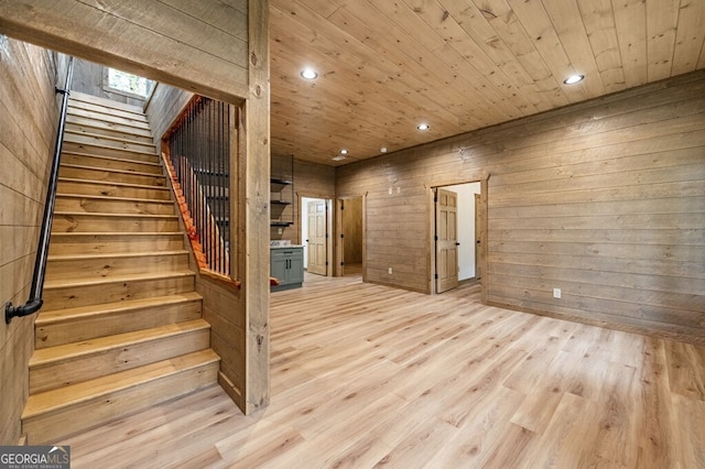 interior space with stairs, light wood-style floors, recessed lighting, and wood ceiling