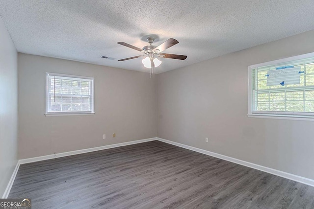 4089 Lindsey Dr, Decatur, GA 30035 - spare room featuring a ceiling fan, visible vents, a textured ceiling, and wood finished floors