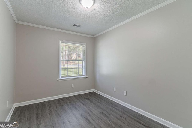 4089 Lindsey Dr, Decatur, GA 30035 - spare room with a textured ceiling, visible vents, ornamental molding, and dark wood-style floors