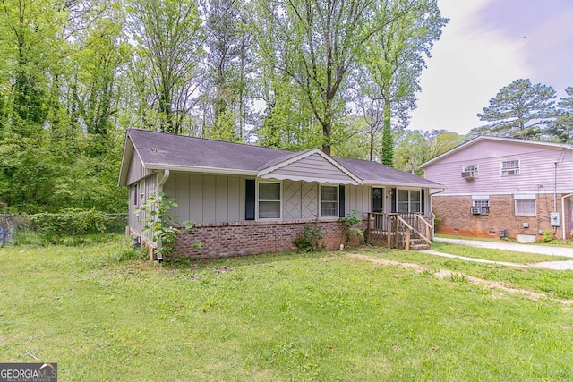 4089 Lindsey Dr, Decatur, GA 30035 - single story home with a front yard, brick siding, and board and batten siding