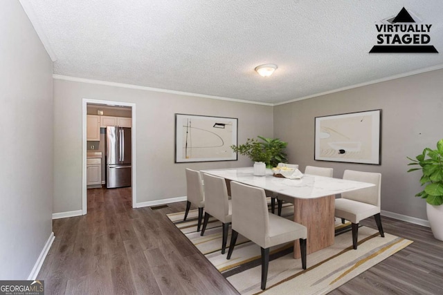 4089 Lindsey Dr, Decatur, GA 30035 - dining space with crown molding, a textured ceiling, baseboards, and dark wood-style floors