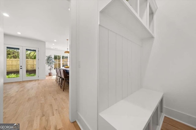 mudroom with baseboards, french doors, light wood-style flooring, and recessed lighting