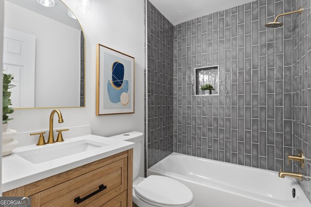 full bath featuring toilet, shower / bath combination, and vanity