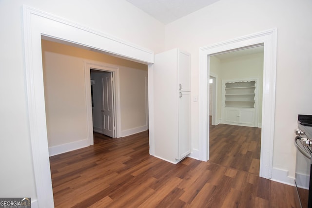 31 Saint Clair St, Newnan, GA 30263 - hall with dark wood-style flooring, baseboards, and built in shelves