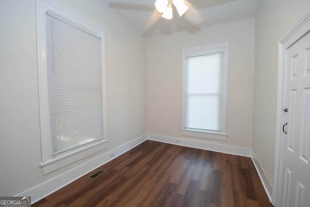 31 Saint Clair St, Newnan, GA 30263 - unfurnished bedroom featuring dark wood-type flooring, baseboards, ornamental molding, and a ceiling fan