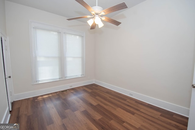 31 Saint Clair St, Newnan, GA 30263 - spare room featuring a ceiling fan, baseboards, and dark wood-style floors