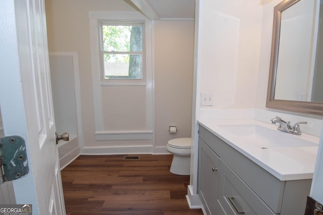 31 Saint Clair St, Newnan, GA 30263 - bathroom featuring wood finished floors, toilet, vanity, a shower, and a bath