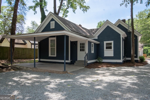 31 Saint Clair St, Newnan, GA 30263 - view of front of house with fence, a chimney, and entry steps