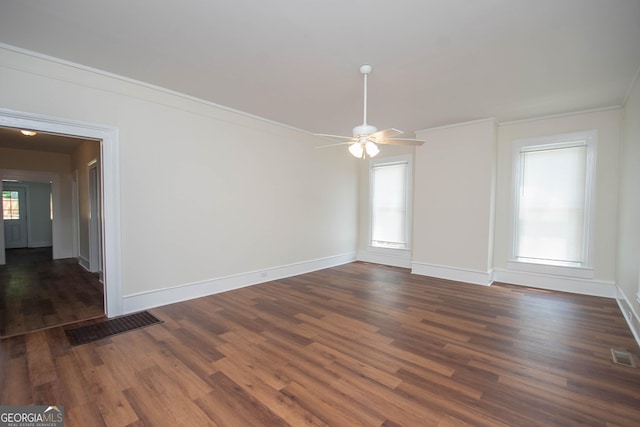 31 Saint Clair St, Newnan, GA 30263 - empty room with ceiling fan, dark wood-type flooring, crown molding, and baseboards