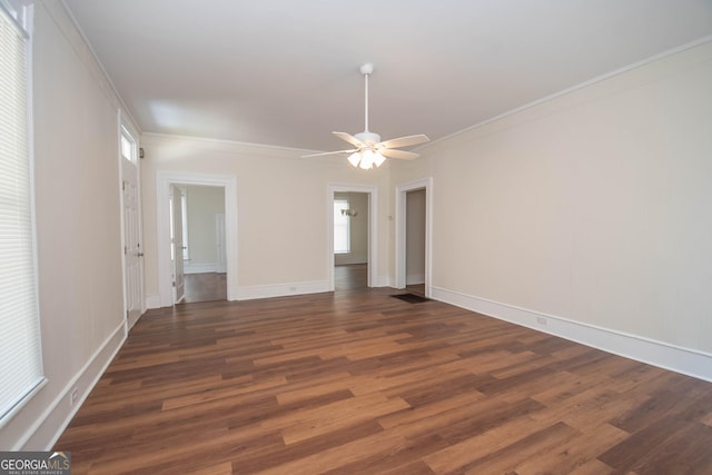 31 Saint Clair St, Newnan, GA 30263 - spare room featuring wood finished floors, a ceiling fan, crown molding, and baseboards