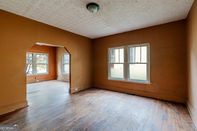 1388 Metropolitan Ave SE, Atlanta, GA 30316 - spare room with baseboards, hardwood / wood-style floors, visible vents, and a textured ceiling