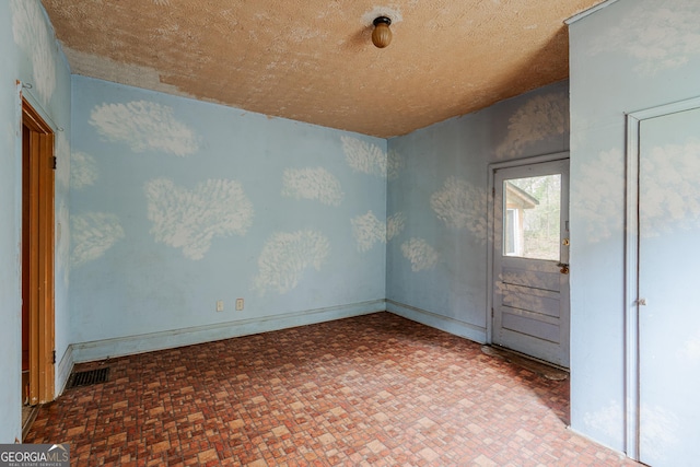 1388 Metropolitan Ave SE, Atlanta, GA 30316 - empty room featuring brick patterned floor and visible vents