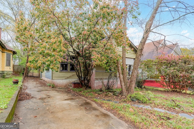 1388 Metropolitan Ave SE, Atlanta, GA 30316 - view of front facade with concrete driveway and fence