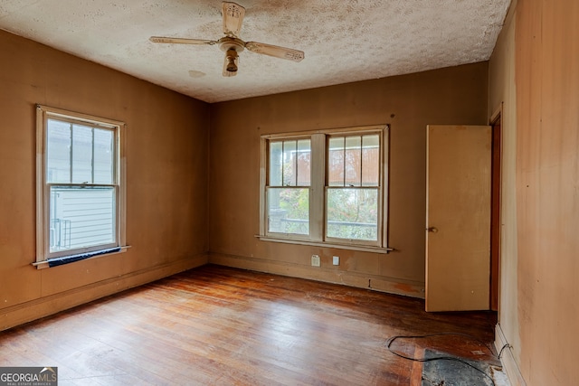 1388 Metropolitan Ave SE, Atlanta, GA 30316 - spare room with light wood-style floors, ceiling fan, and a textured ceiling