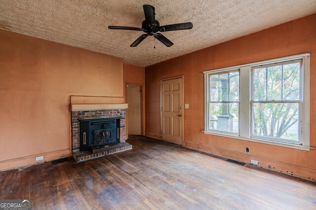 1388 Metropolitan Ave SE, Atlanta, GA 30316 - unfurnished living room with wood finished floors, a ceiling fan, a textured ceiling, visible vents, and baseboards