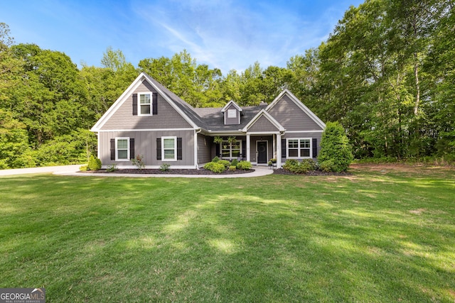 88 Carl Williams Rd, Senoia, GA 30276 - shingle-style home featuring a front lawn, covered porch, and board and batten siding