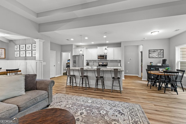 88 Carl Williams Rd, Senoia, GA 30276 - living room featuring light wood-style flooring, baseboards, and recessed lighting
