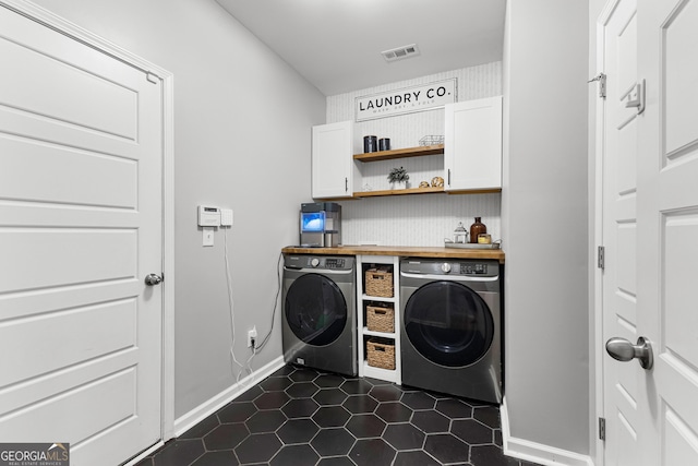 88 Carl Williams Rd, Senoia, GA 30276 - washroom with separate washer and dryer, cabinet space, dark tile patterned floors, and baseboards