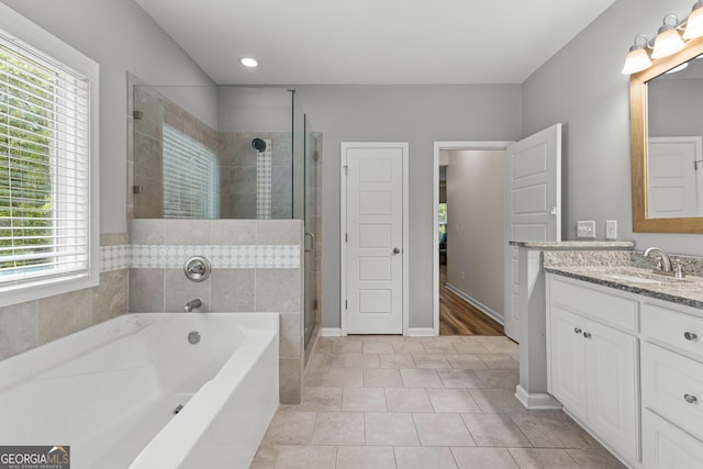 88 Carl Williams Rd, Senoia, GA 30276 - bathroom with healthy amount of natural light, vanity, a bath, a shower stall, and recessed lighting