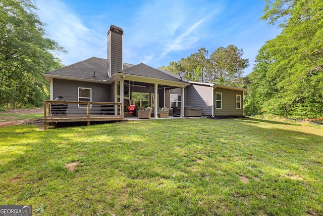 88 Carl Williams Rd, Senoia, GA 30276 - rear view of house featuring an outdoor living space, a chimney, a lawn, a wooden deck, and a shingled roof