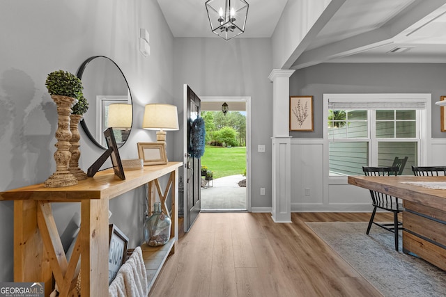 88 Carl Williams Rd, Senoia, GA 30276 - entryway featuring wood finished floors, a chandelier, baseboards, and decorative columns