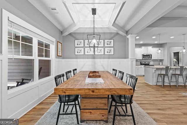 88 Carl Williams Rd, Senoia, GA 30276 - dining room featuring light wood finished floors, recessed lighting, a wainscoted wall, and a decorative wall