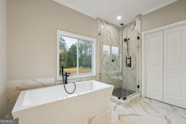 1330 Adams Dr SW, Atlanta, GA 30311 - full bath with marble look tiles, tile walls, a marble finish shower, a freestanding bath, and recessed lighting