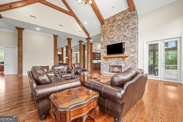 350 Greystone Dr, Milledgeville, GA 31061 - living area with wood finished floors, decorative columns, beamed ceiling, and high vaulted ceiling