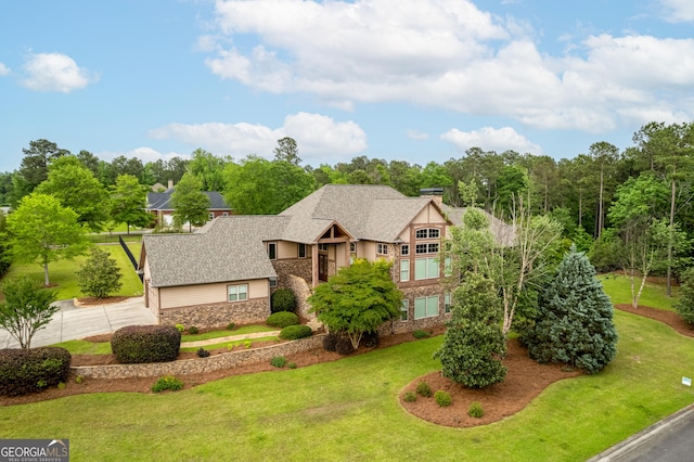 350 Greystone Dr, Milledgeville, GA 31061 - tudor house with a front lawn, stone siding, and driveway