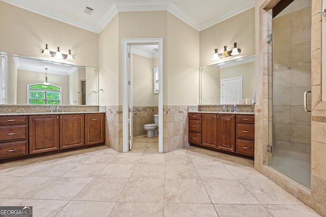 350 Greystone Dr, Milledgeville, GA 31061 - bathroom with crown molding, visible vents, tile walls, and a stall shower