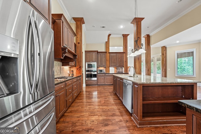 350 Greystone Dr, Milledgeville, GA 31061 - kitchen featuring a sink, stainless steel appliances, dark wood finished floors, decorative backsplash, and ornamental molding