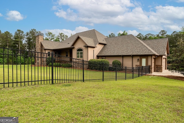 350 Greystone Dr, Milledgeville, GA 31061 - view of front of property with fence, a shingled roof, a front lawn, and a chimney