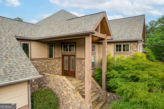 350 Greystone Dr, Milledgeville, GA 31061 - view of front of property featuring stone siding, roof with shingles, and french doors