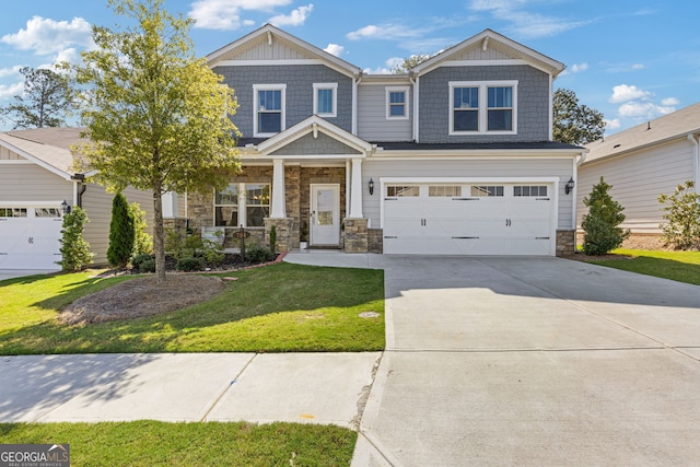 craftsman-style home with a porch, an attached garage, stone siding, driveway, and a front yard