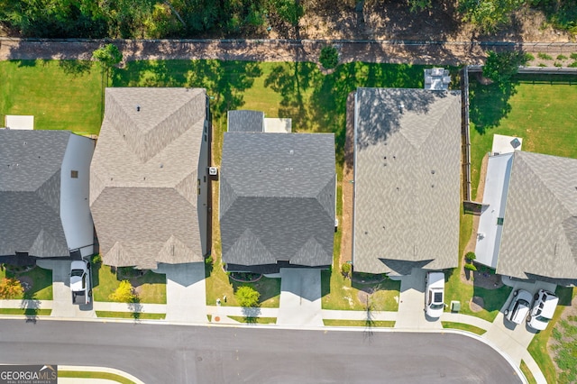 birds eye view of property with a residential view