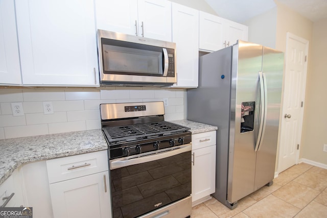 kitchen featuring white cabinetry, decorative backsplash, and appliances with stainless steel finishes