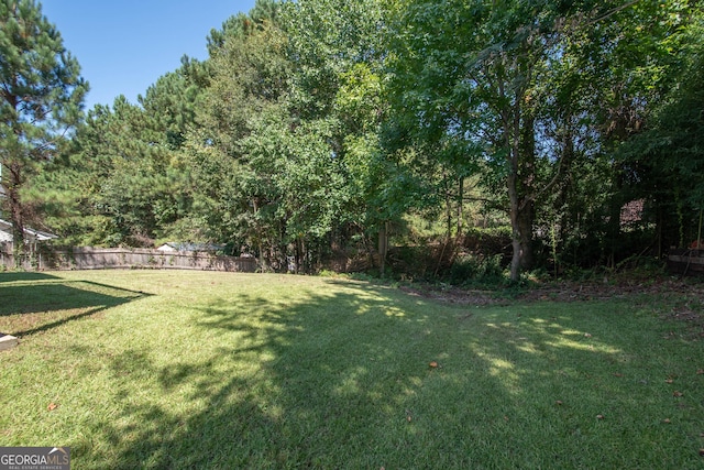 view of yard with fence