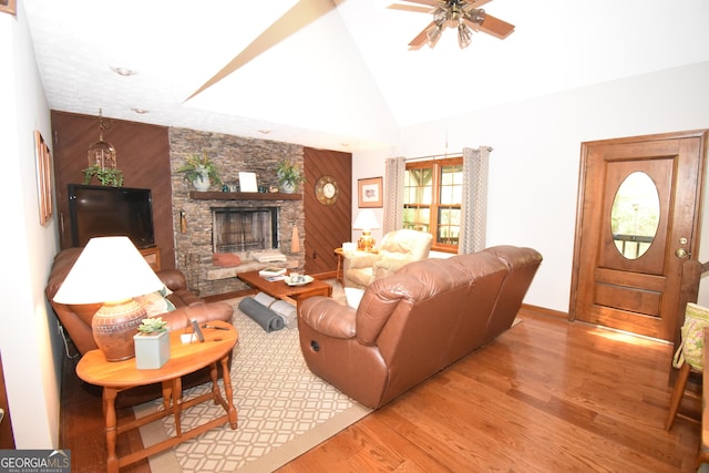4056 Ryckeley Dr, Gainesville, GA 30504 - living area with light wood-style flooring, high vaulted ceiling, baseboards, a stone fireplace, and ceiling fan