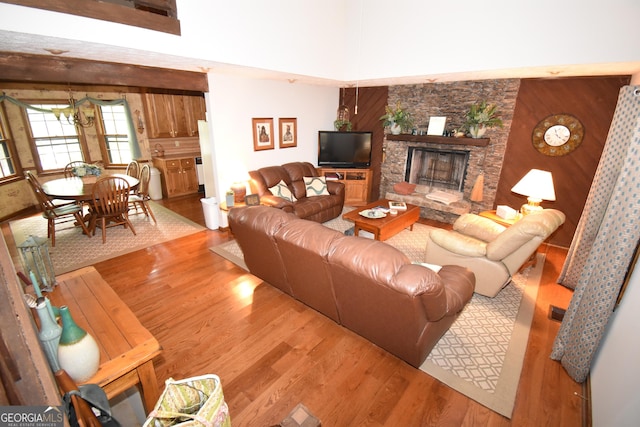4056 Ryckeley Dr, Gainesville, GA 30504 - living area featuring wood finished floors and a stone fireplace