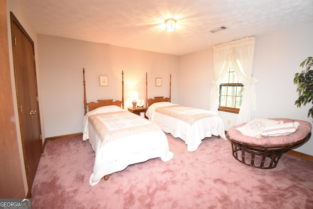 4056 Ryckeley Dr, Gainesville, GA 30504 - carpeted bedroom with a textured ceiling, baseboards, and visible vents
