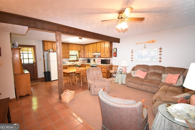 4056 Ryckeley Dr, Gainesville, GA 30504 - living area with a ceiling fan, beamed ceiling, baseboards, and light tile patterned floors