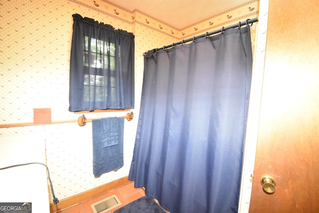 4056 Ryckeley Dr, Gainesville, GA 30504 - bathroom with wallpapered walls, visible vents, and ornamental molding