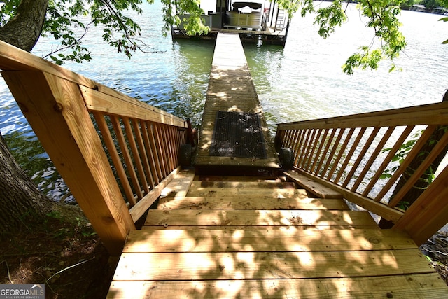 4056 Ryckeley Dr, Gainesville, GA 30504 - wooden terrace with a water view and a boat dock