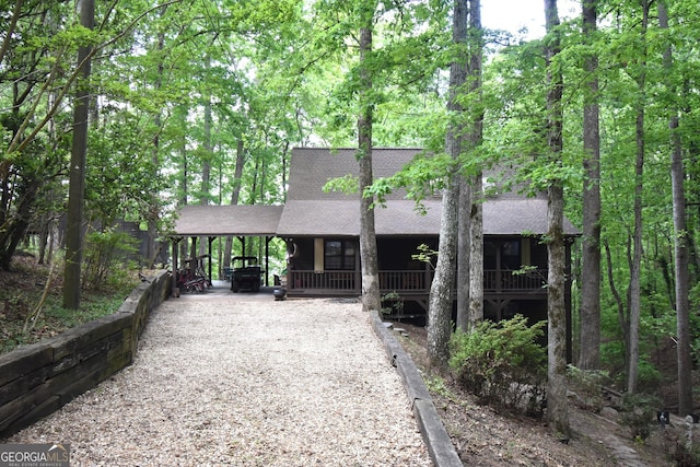 4056 Ryckeley Dr, Gainesville, GA 30504 - rustic home with a shingled roof, covered porch, and driveway